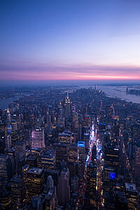 aerial view of city buildings during nighttime thumbnail
