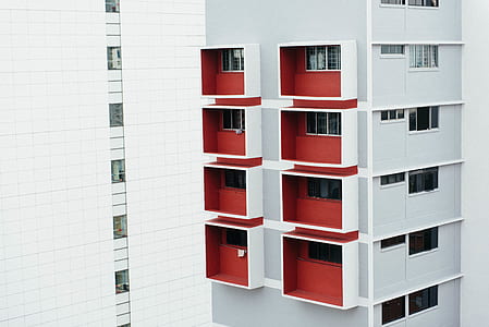 red and white high-rise building thumbnail