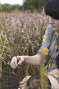 Woman Holding Green Plant thumbnail