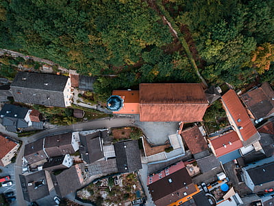 aerial view of village near trees during daytime thumbnail