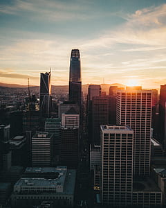 aerial shot of black and white building during sunset thumbnail