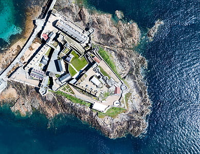 aerial photography of structures on island thumbnail