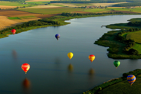 hot air balloons on body of water thumbnail
