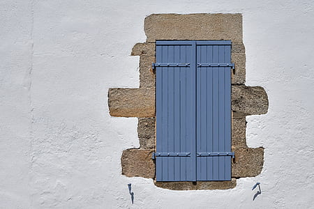 closed gray wooden door thumbnail