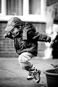 grayscale photo of juming boy thumbnail