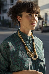 woman wearing teal and pink top thumbnail