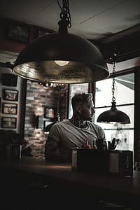 man sitting on stool thumbnail