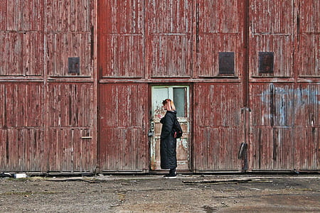 woman in front of white wooden door thumbnail