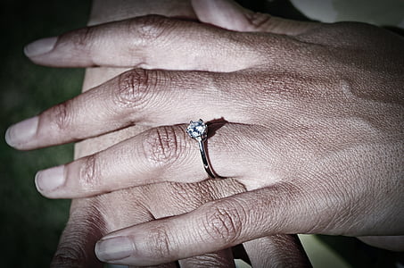 person wearing clear jeweled silver-colored ring thumbnail