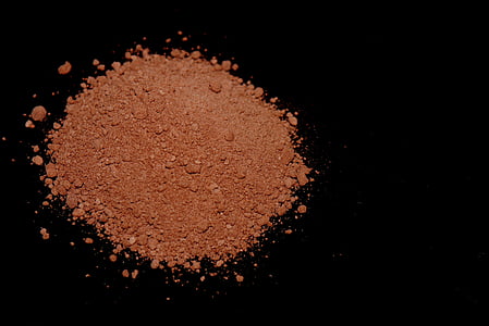 brown powder on black surface thumbnail