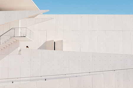 woman standing on beige concrete building thumbnail