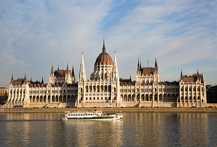 white castle beside body of water with boat thumbnail