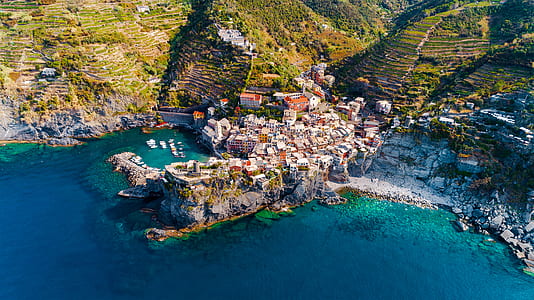 aerial view photography of village beside seashore thumbnail