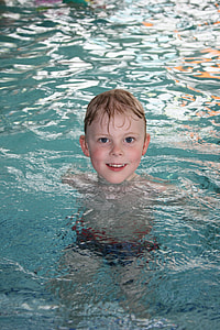 boy in swimming pool photo thumbnail