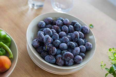 Plums in the bowl at kitchen thumbnail