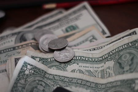 photo of US dollar banknotes and coins thumbnail