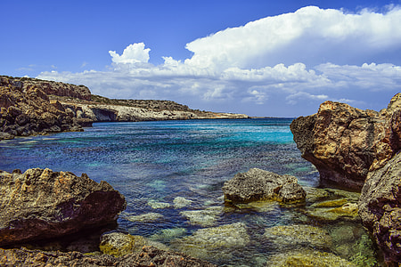 photo of sea under clear blue sky thumbnail