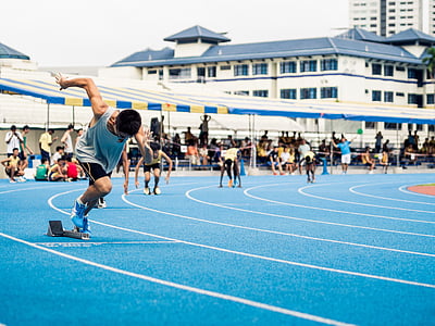 men dashing on running track thumbnail