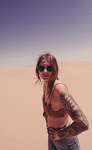 woman wearing brown bralette and jeans thumbnail