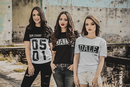 three women standing beside each other thumbnail