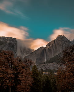 time lapse photography of water falls at mountain thumbnail
