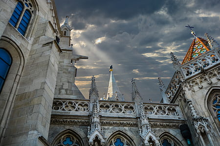 gray concrete building under cloudy sky thumbnail