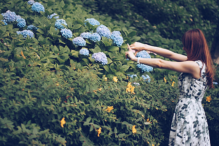 woman wearing gray digital camouflage skater dress beside on flower thumbnail