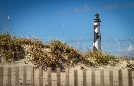 black and white lighthouse on mountain thumbnail