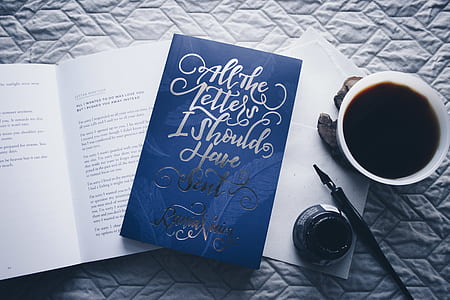 blue quote board beside of coffee mug and ink bottle thumbnail
