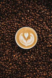 white mug filled with heart coffee art thumbnail