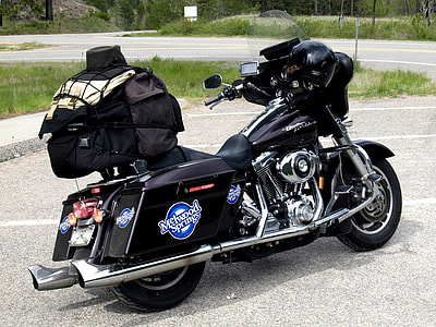black touring motorcycle park near road during daytime thumbnail