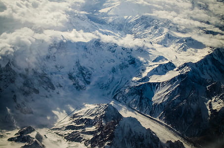 bird's eye photography of mountain cliff covered with snows thumbnail