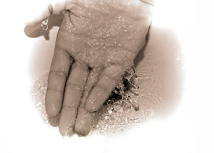 person's hand in water thumbnail
