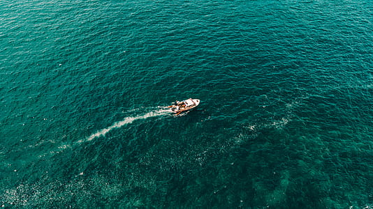 aerial photography of boat on body of water thumbnail