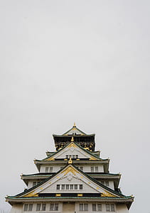 low angle photography of white and green painted castle thumbnail