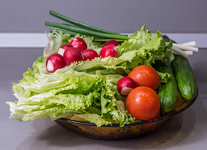 two green Cucumbers,orange tomatoes and green cabbage thumbnail