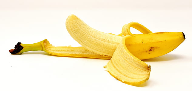 closeup photo of yellow banana on white surface thumbnail