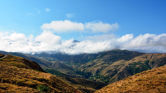 top view of mountain under blue skies thumbnail