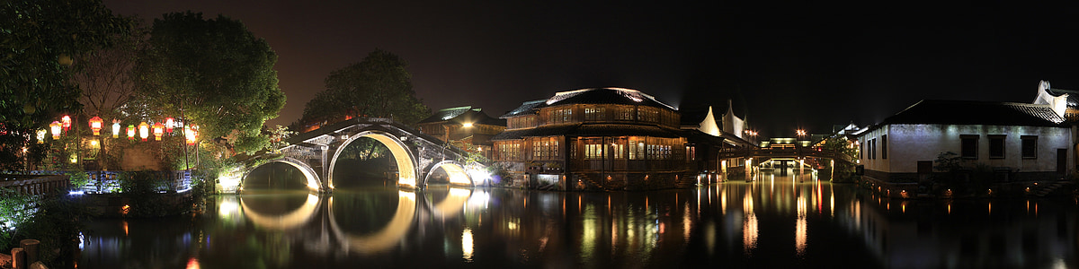buildings and bridge at night time thumbnail