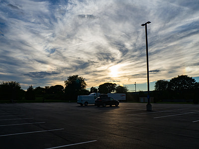 two cars on parking area during daytime thumbnail