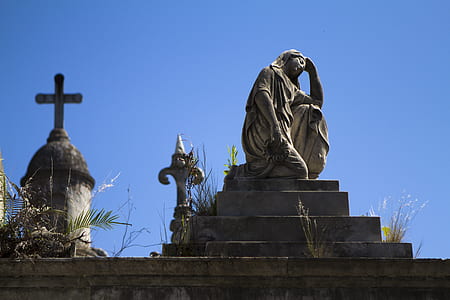 Woman Statue Near Cross during Daytime thumbnail