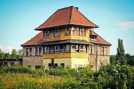 brown 2-storey house at day time thumbnail
