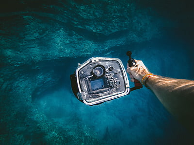 person holding water camera thumbnail