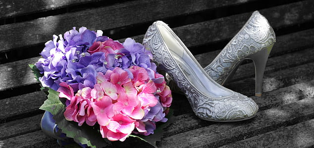 pair of silver shoes and bouquet of flowers thumbnail