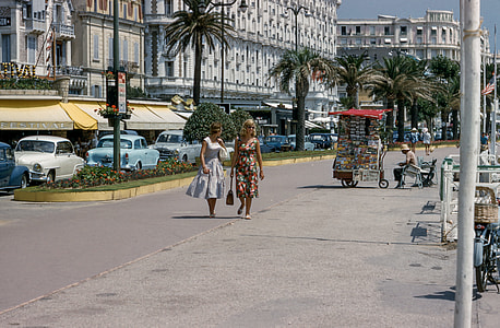 two women walking on the sidewalk thumbnail