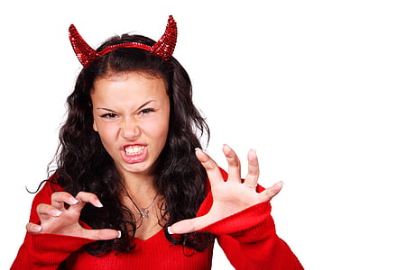 woman wearing devil costume performs scary gesture thumbnail