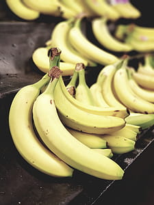 Selective Focus Photo of Bunch of Bananas on Black Surface thumbnail