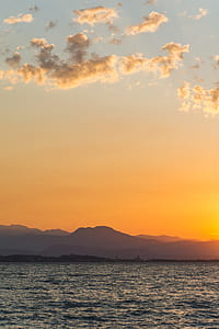 body of water during sunset thumbnail