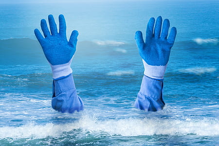 pair of blue gloves on water thumbnail