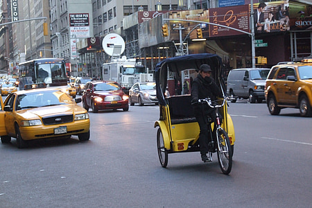 man riding auto rickshaw on street during daytime thumbnail